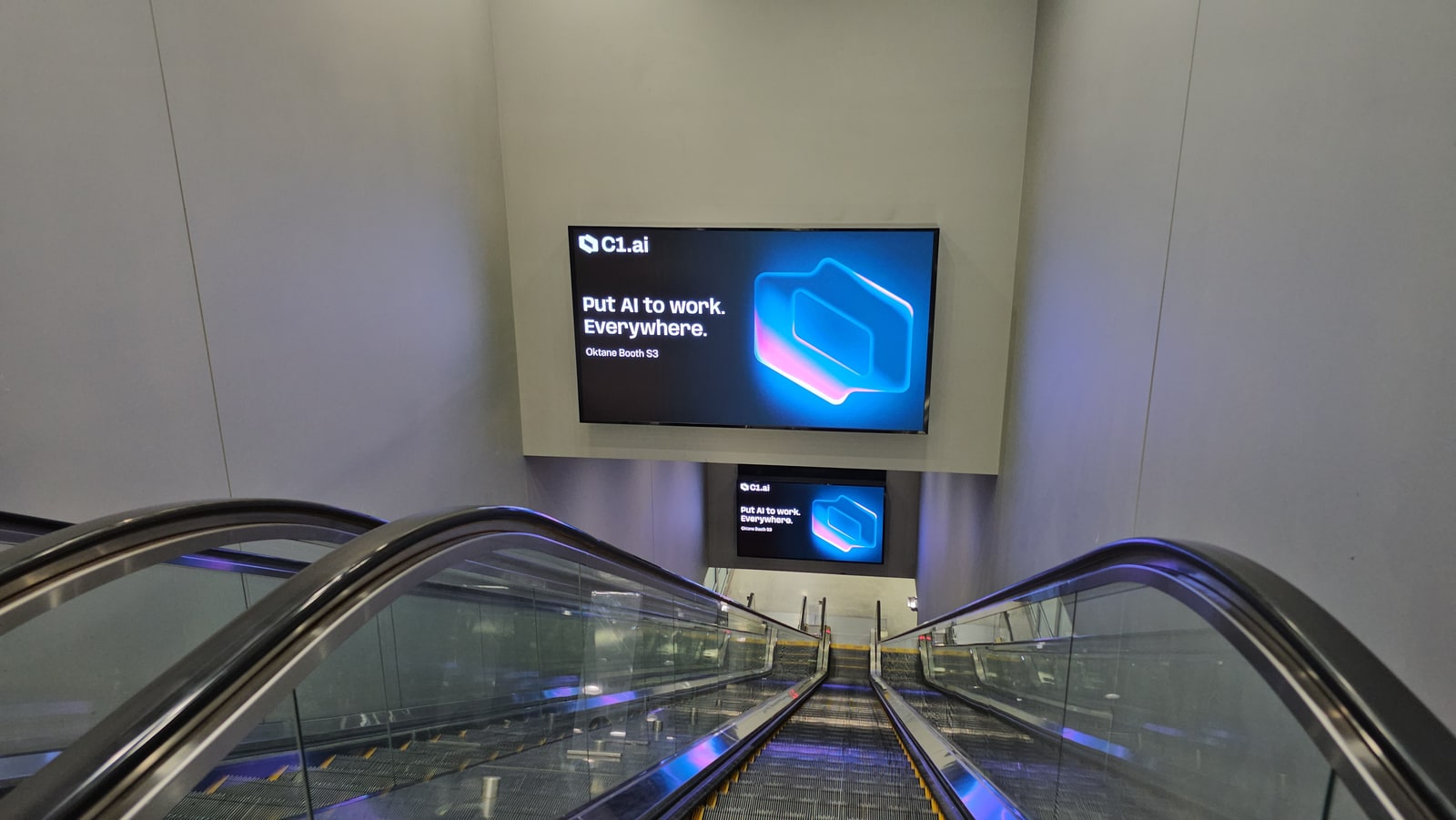 C1 digital advertising screens above Terminal 3 escalators at Harry Reid International Airport