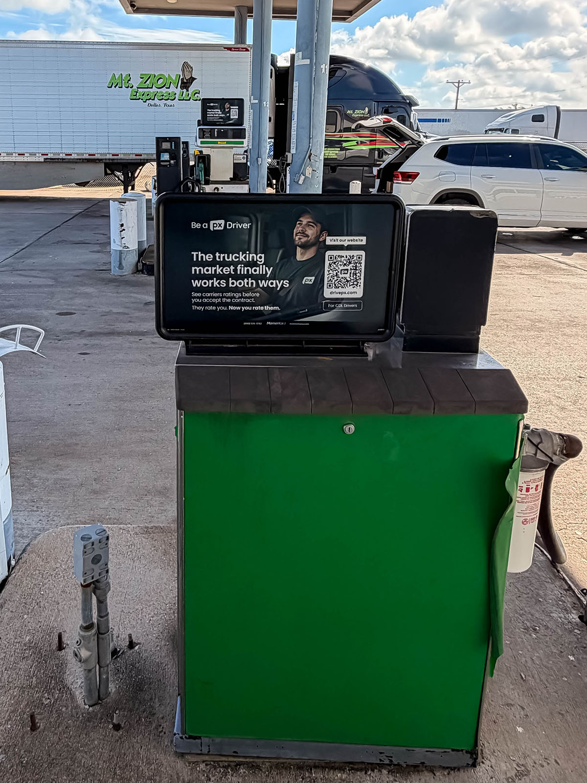 Fuel pump top truck stop ads reaching drivers while they refuel