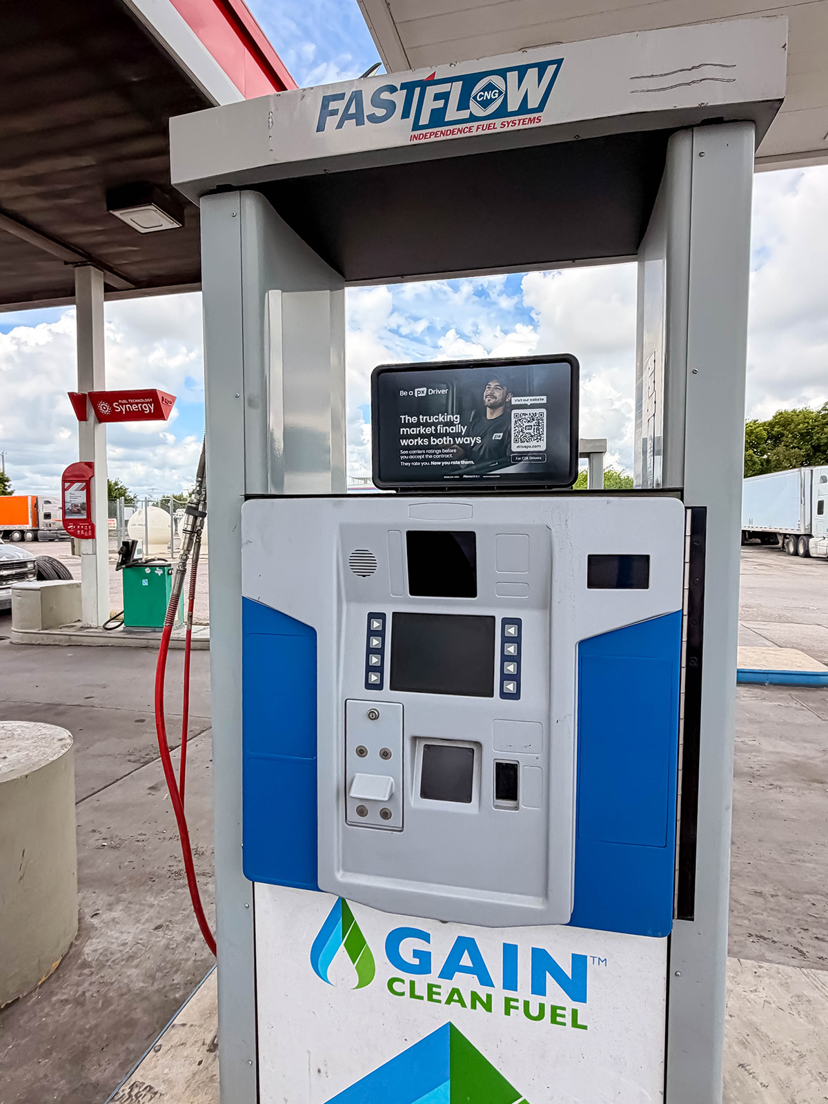 Truck stop advertising displayed on a fuel pump top for a driver recruitment campaign