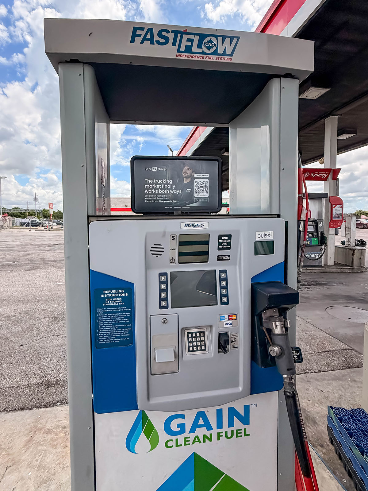 Pump top advertising at a truck stop promoting professional driver recruitment