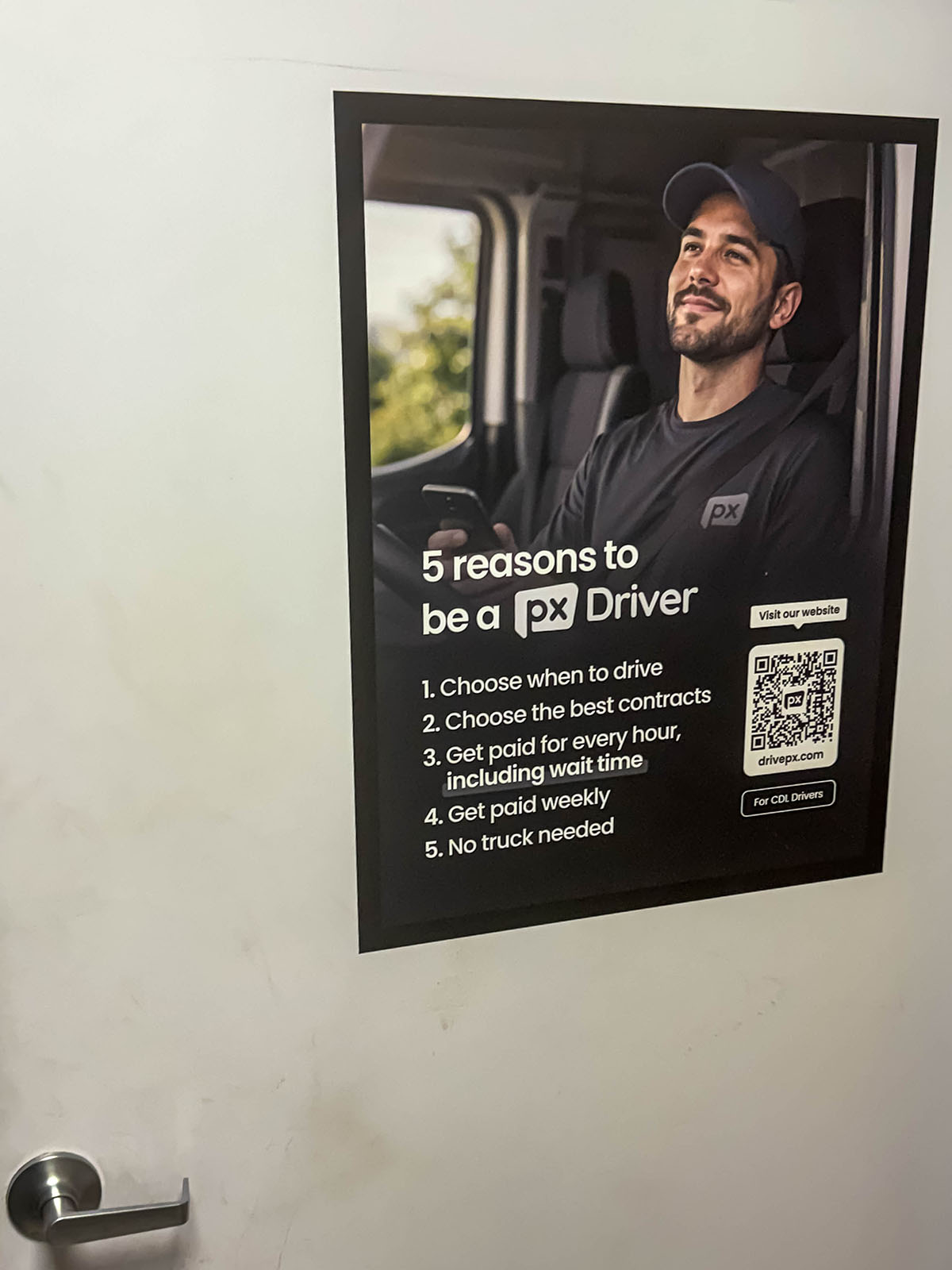 Truck stop restroom ads used as part of a professional driver recruitment campaign